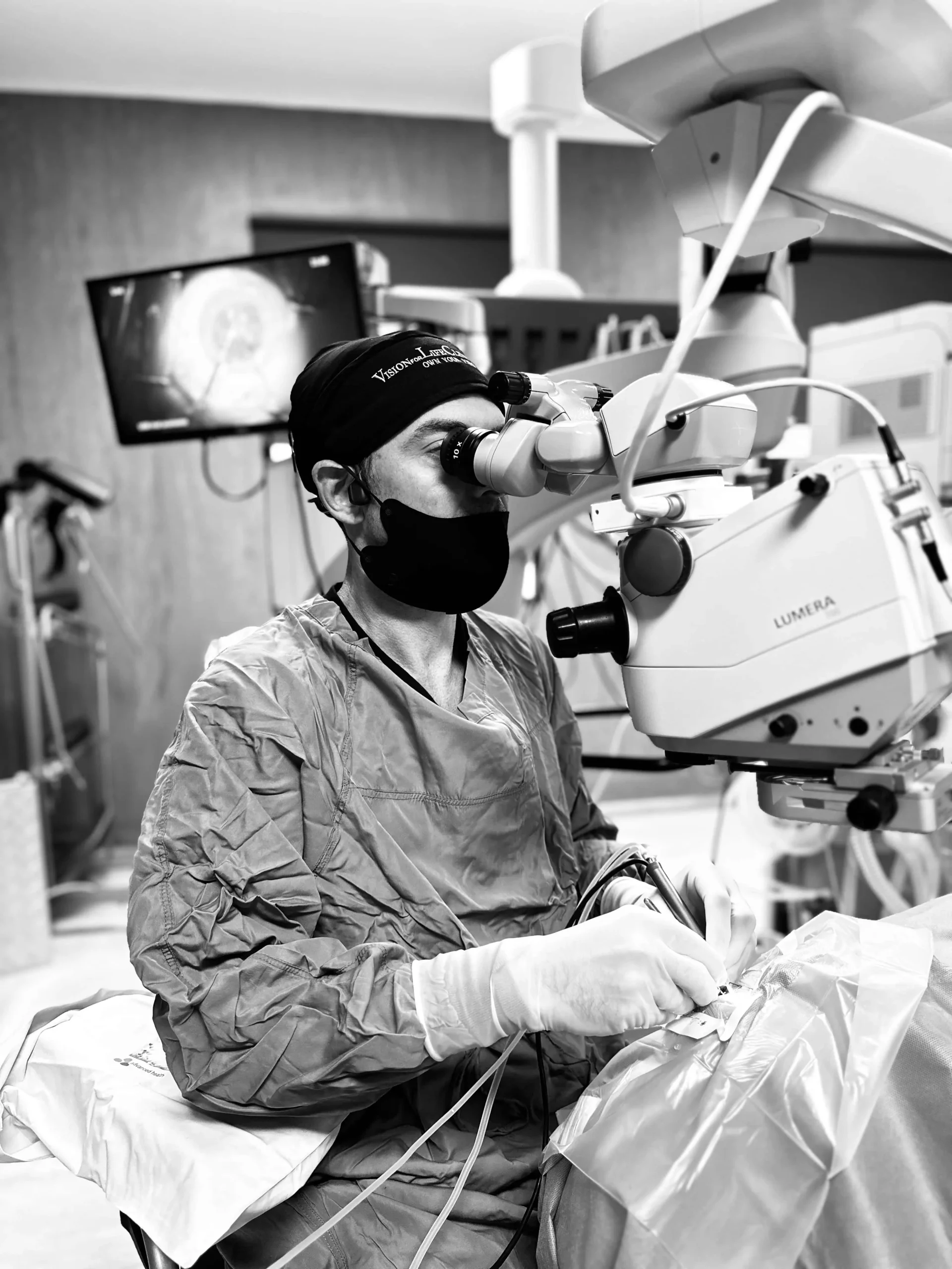 Dr Dylan Joseph operating under the surgical microscope